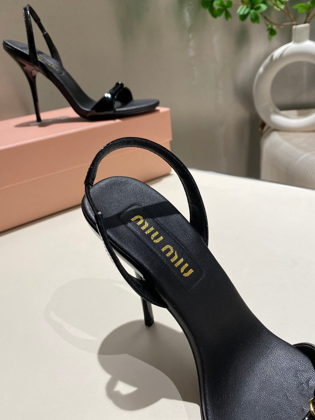 TWO STRAP HIGH HEELED SANDALS IN BLACK GLOSSY SHEEPSKIN
